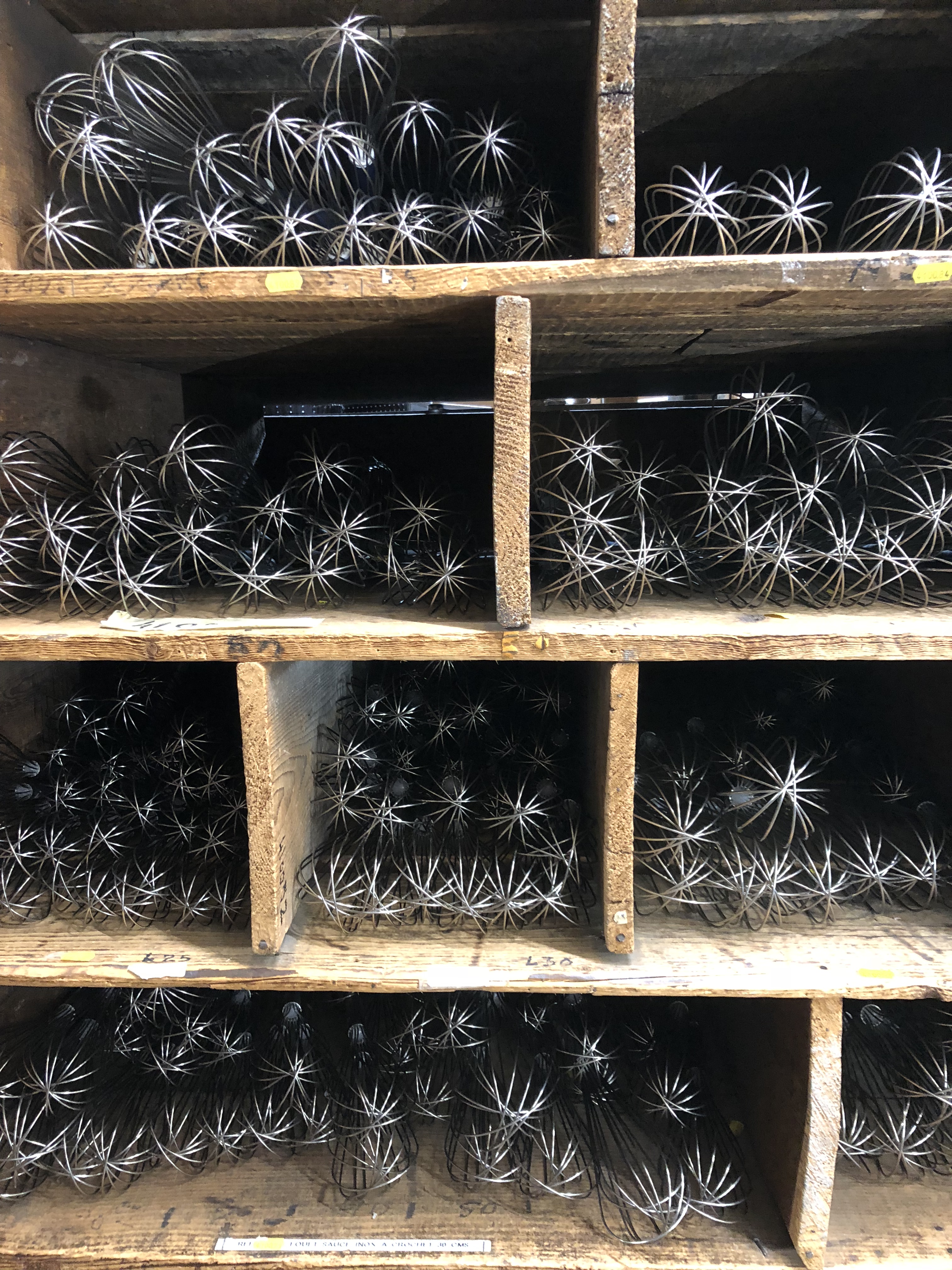 Whisks Inside An Old Fashioned Parisian Hardware Store