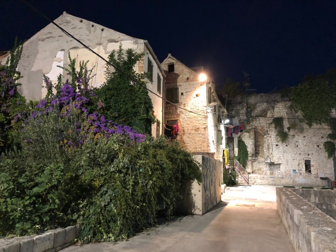 Split At Night: Houses and Palace Walls Draped With Washing