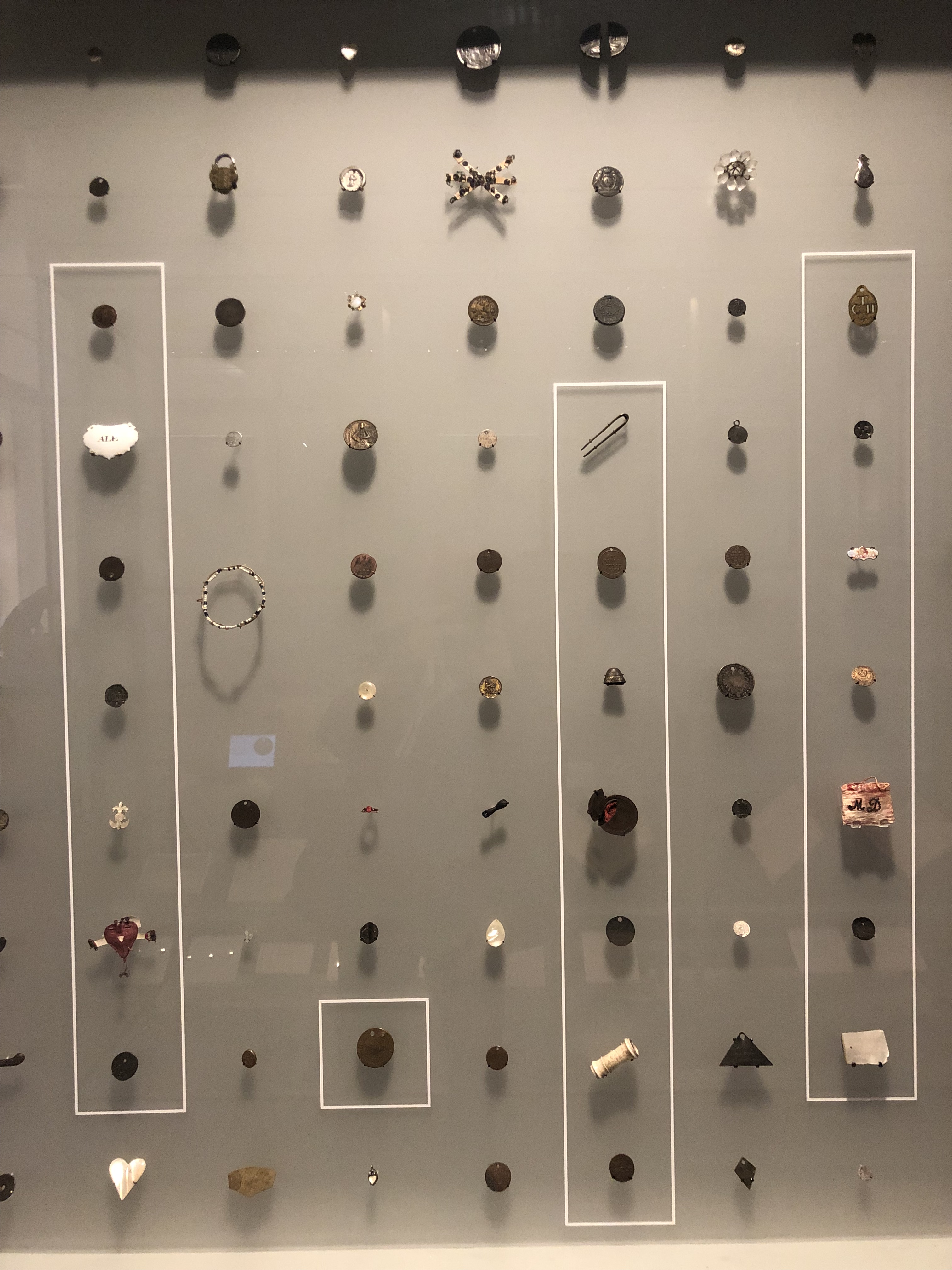 A Selection Of Tokens On Show At The Foundling Museum