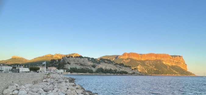 The Cliffs Overlooking Cassis Harbour At Sunset